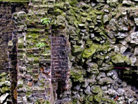 Medieval brick wall beside Romal stone wall