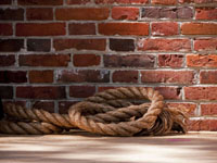 rope against vintage brick wall