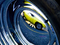 1970s Mustang reflected in hubcap