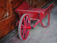 old wheelbarrow in barn
