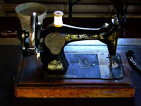 antique singer sewing machine on table