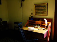 antique writing desk against wall