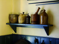 antique containers on kitchen shelf