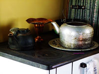 kettles on old antique stove