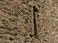 arrow slot in Medieval stone wall