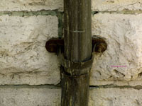 copper pipe on stone wall