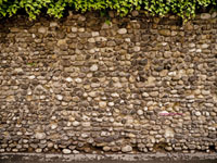 old stone wall made from stream stones