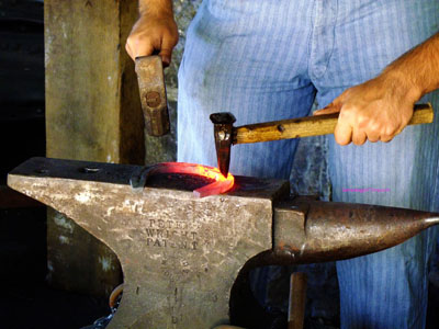 blacksmith striking an anvil